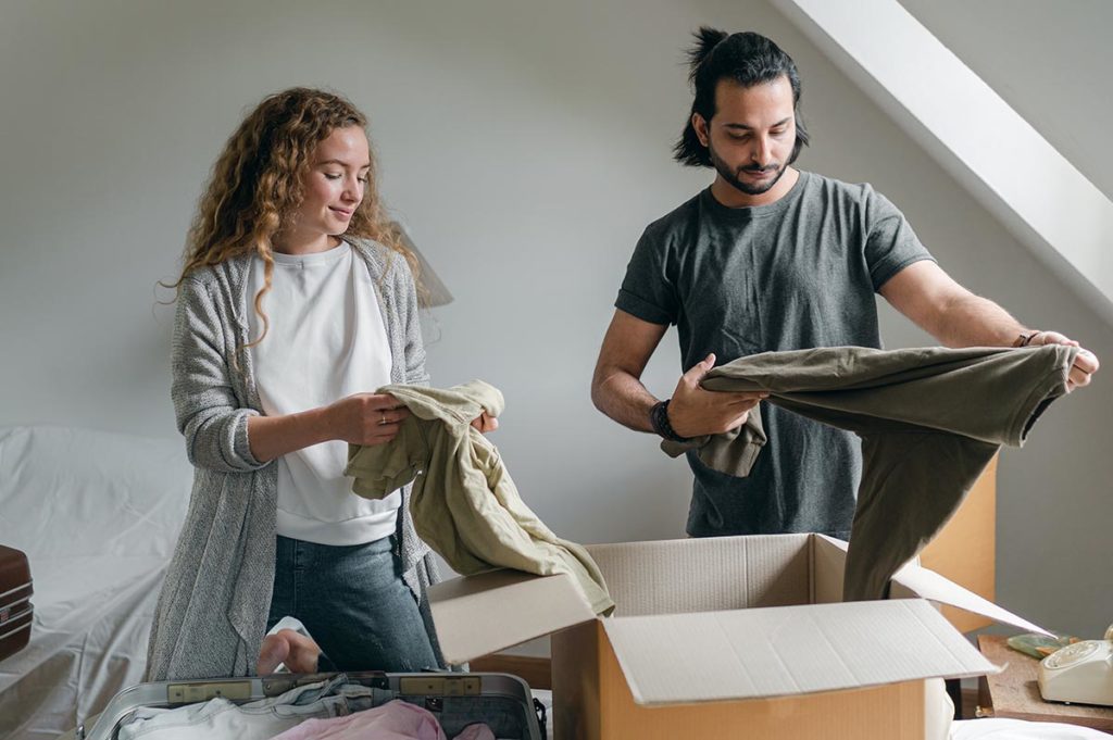 Couple sorting items as a preparation to use self-storage during renovation