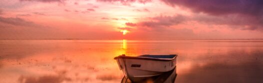 The title image of the blog. A picture of an aluminium boat at sea.