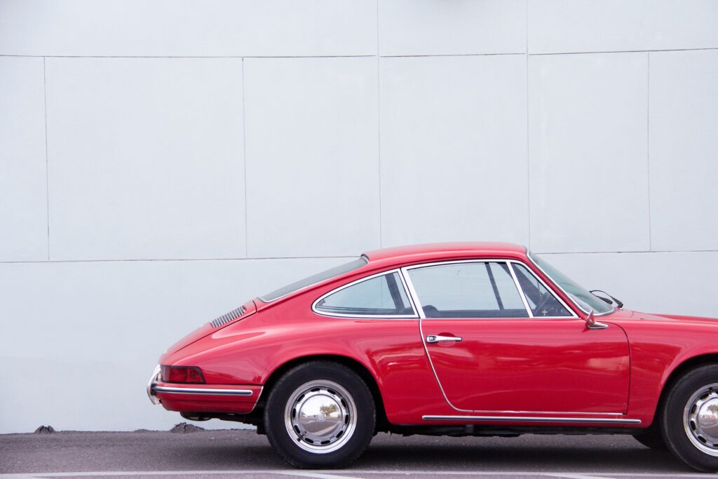 A vintage vehicle parked in storage.