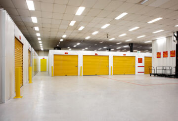 Inside storage units, with yellow roller doors